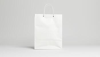 White paper bag on a plain surface photo