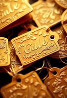 pile of gold tags with the word sale written on them photo