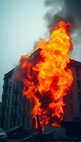 large building with a lot of fire coming out of it photo