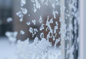 close up of a frosted window with a building in the background photo