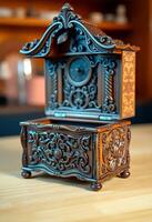 small wooden clock sitting on top of a table photo