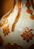 close up of a vase with a decorative design on it photo