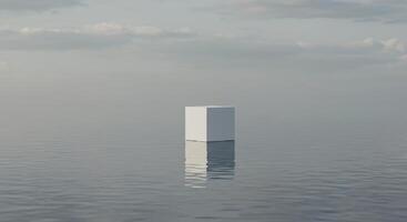 A white cube floating in the middle of a body of water photo