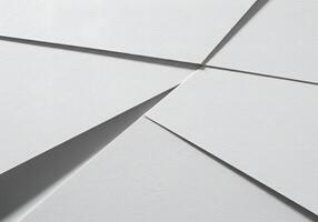 White paper background with a few pieces of paper photo