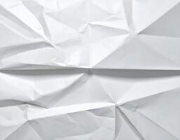Crumpled paper background with white background photo