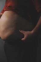 A person with a belly in the dark photo