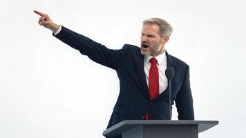 Man Speaking Angrily at Podium with Pointing Gesture photo