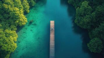 Aerial view of a wooden bridge over a lake photo