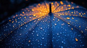 A close up of a blue umbrella with water droplets photo