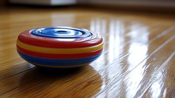 A toy ball on a wooden floor photo