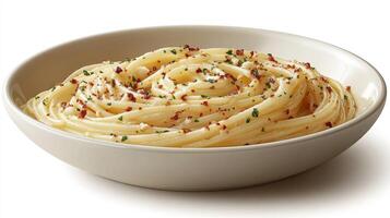 A bowl of spaghetti with herbs and cheese photo