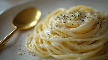 A white plate with spaghetti photo