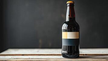 A bottle of beer sitting on a wooden table photo