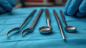 A surgeon's hands holding surgical tools photo