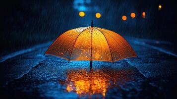 An orange umbrella is standing in the rain photo