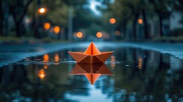 Paper boat on wet road photo