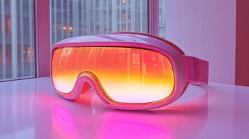 A pair of goggles with pink and orange lights photo