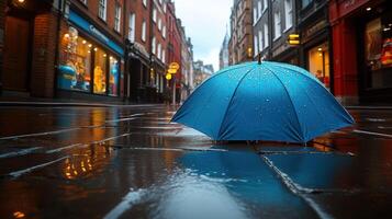 A blue umbrella on the ground photo