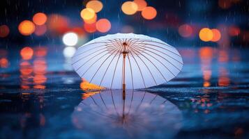A white umbrella sitting in the rain photo