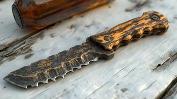 A knife with a handle and a bottle photo