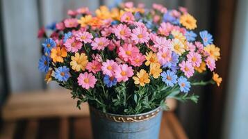 A vase filled with colorful flowers sitting on a table photo