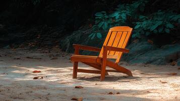 A chair sitting on the sand photo