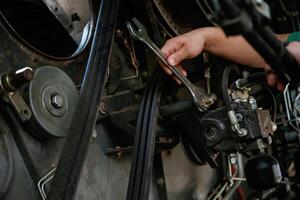 Mechanic, working ,on ,industrial machinery in a workshop photo