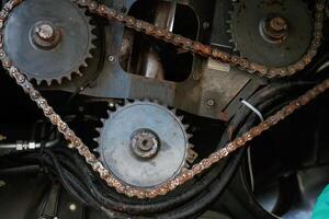 Close-up of industrial,, gears and chains in machinery photo