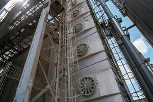 Industrial, structure with metal framework and ventilation fans photo