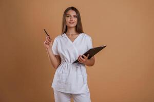 Documents, in hands. Young pretty woman is against background in the studio photo