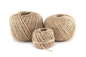Three balls of twine in different sizes arranged on a clean, white background, isolated. photo