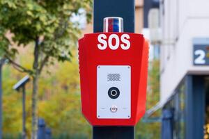 SOS, police, emergency button in a public park. photo