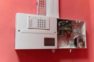 Fire alarm control panel is activated and in alert mode. Selective focus photo