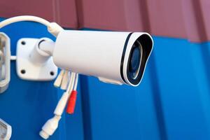 installation of a security camera on the roof of the house photo