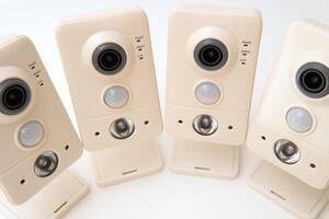 Front view of new security surveillance camera on white background. Clipping path photo