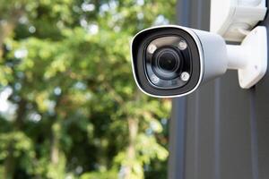 IP CCTV camera install by have water proof cover to protect camera with home security system concept with blur background photo