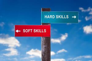 Hard Skills versus Soft Skills - Road sign with two options. photo
