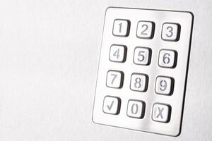 Tilted metallic numeric keypad panel photo
