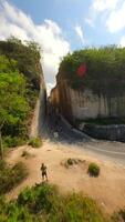 Smooth FPV drone flight through scenic limestone canyon at Batu Barak Beach, Bali, Indonesia. video