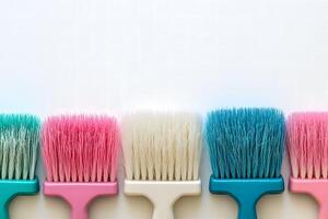 Colorful Paint Brushes in Vibrant Hues Lined Up Against a Light Background for Creative and Artistic Projects, Home Improvement, and DIY Crafts photo