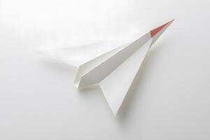 Minimalist White Paper Airplane on Plain Background Ideal for Concepts of Imagination, Creativity, Innovation, and Freedom in Various Design Projects photo