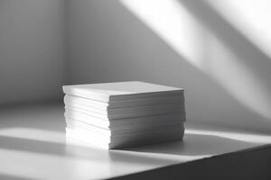 Stacked Blank White Paper Sheets on a Light Surface with Soft Shadows Creating an Artistic and Minimalist Composition for Creative Projects photo