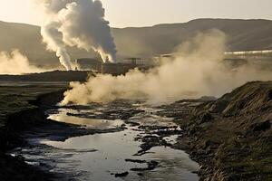 Industrial landscape showing steam and smoke rising from pipes, with a river and surrounding hills in the background during golden hour lighting conditions photo