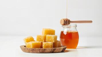 Natural Honeycomb Cubes and Jar Isolated photo