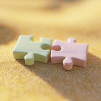 Two pieces of puzzle pieces on the beach photo