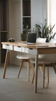 wooden table with a laptop on it photo