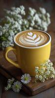 Cup of coffee is elegantly presented with latte art in bright yellow mug, radiating warmth and delight, complemented by delicate white flowers photo