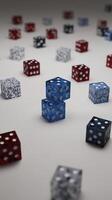 Collection of colorful dice scattered on surface, featuring blue, red, and white dice with various patterns. focus is on two blue dice stacked in center, creating playful and dynamic scene photo