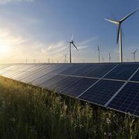 Vast array of solar panel stretches towards horizon, windmills standing tall as symbol of clean energy. An optimistic future built on sustainble source photo