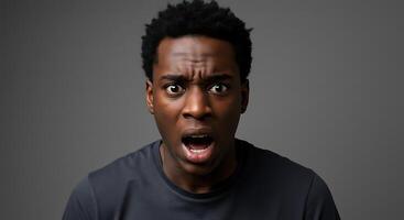 A man with an open mouth and surprised expression photo